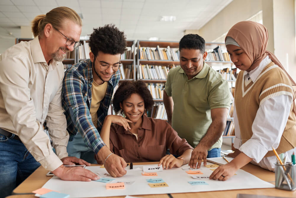 Group of students with learning board